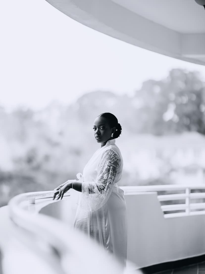 Bride in lace robe on balcony