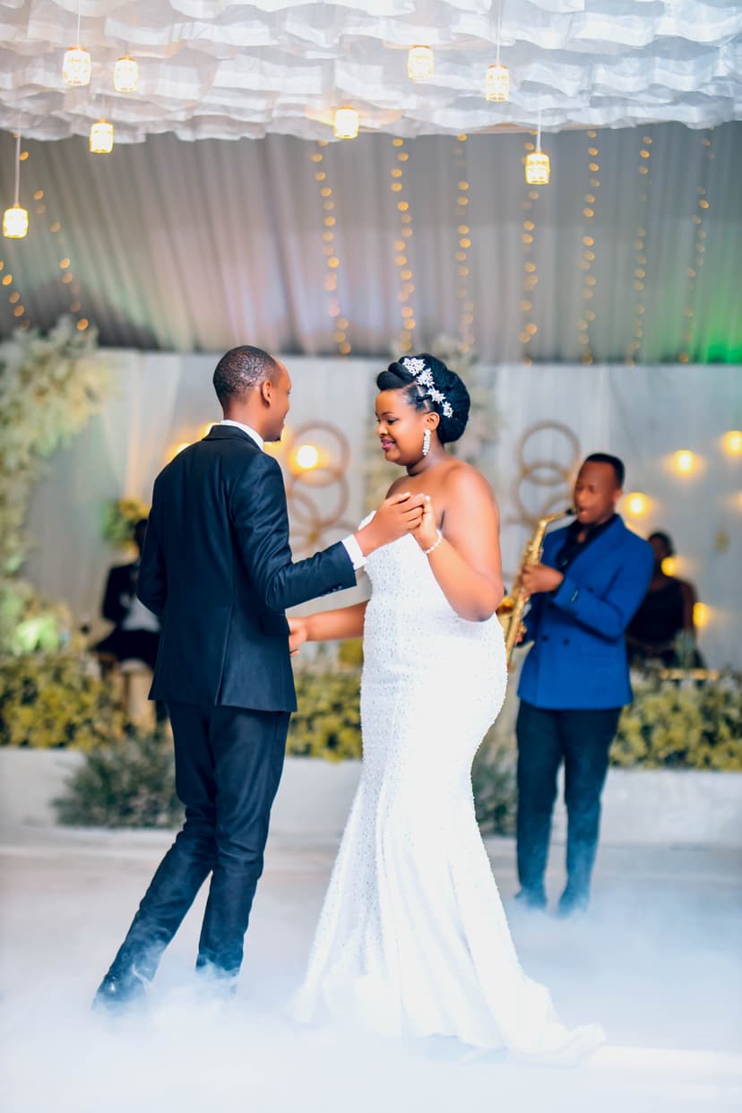 Couple's first dance with fog and live saxophonist
