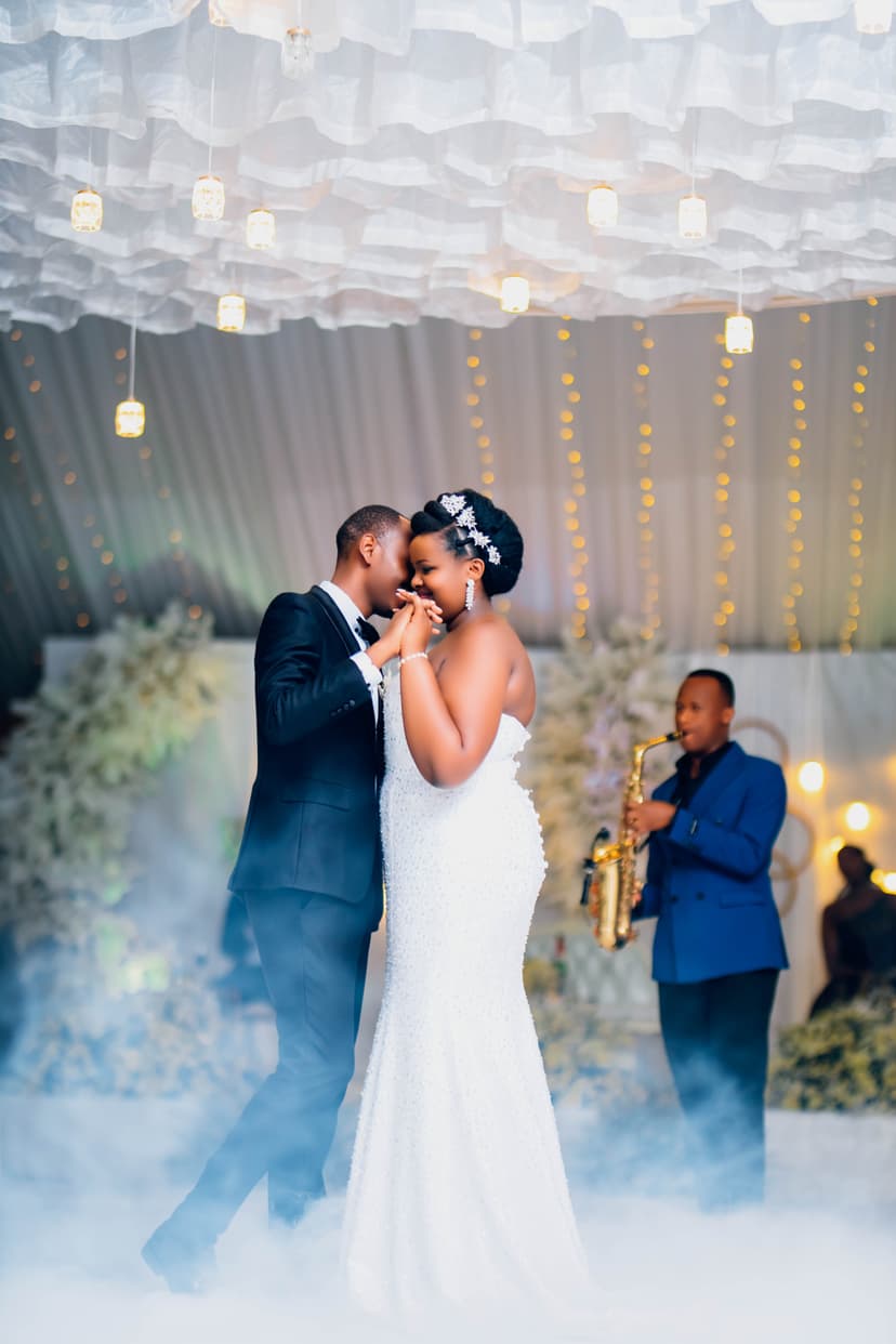 First dance couple with fog machine and saxophonist