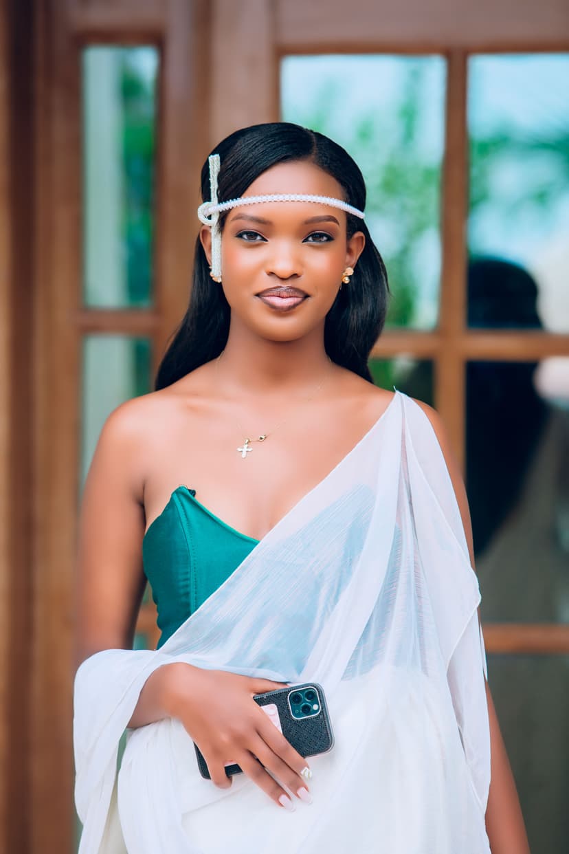 Bride with phone and jewelry in elegant dress