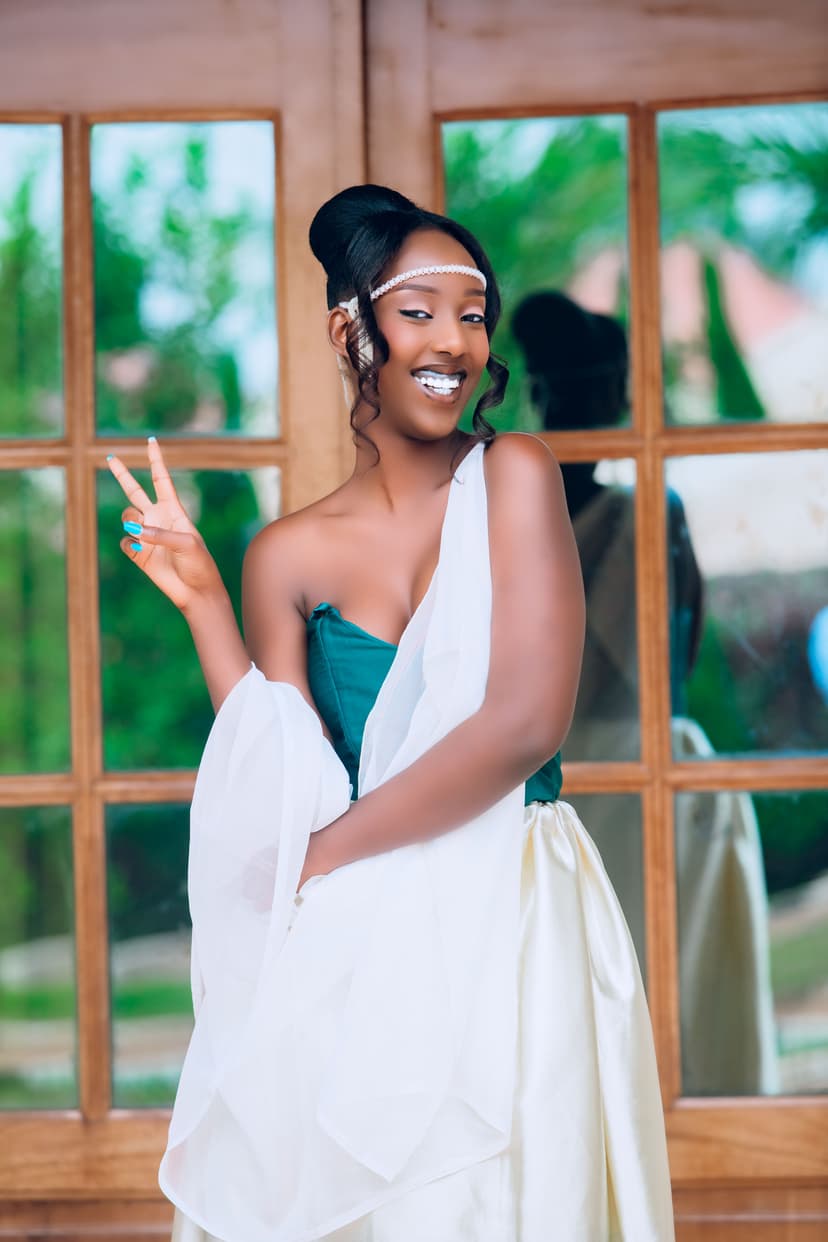 Bride showing peace sign in elegant wrap