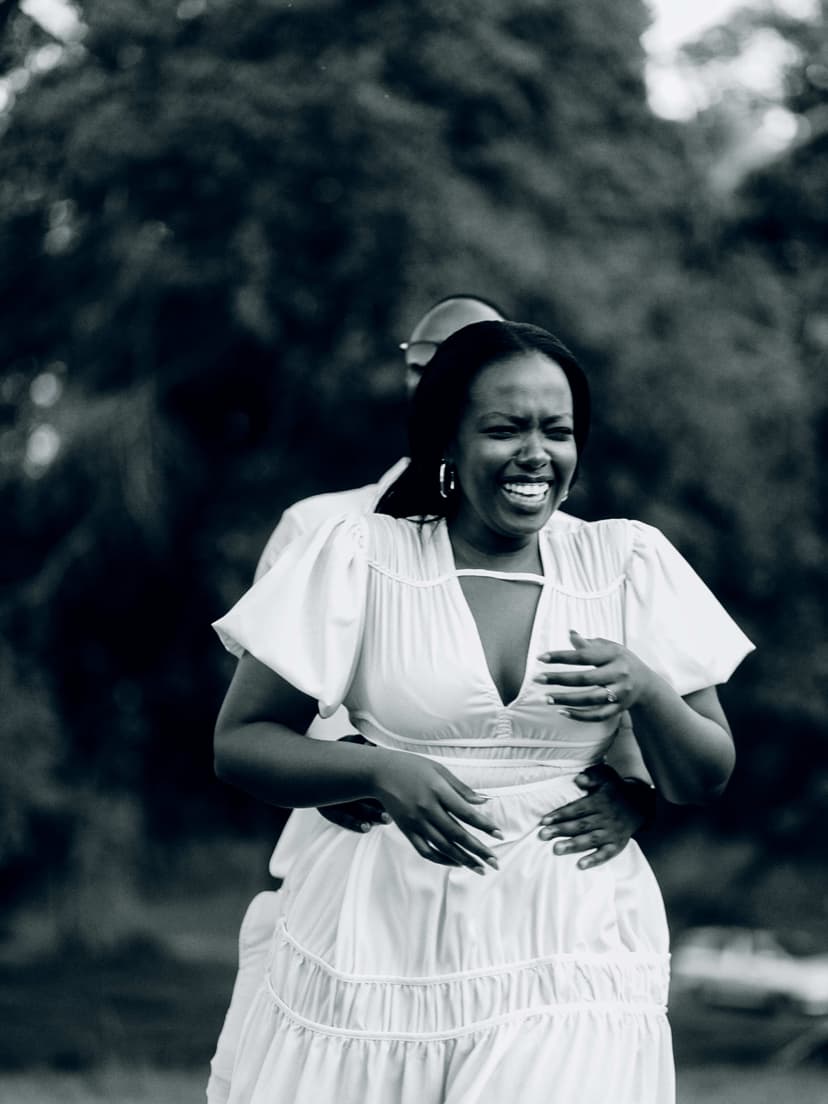 Black and white portrait of happy woman in garden