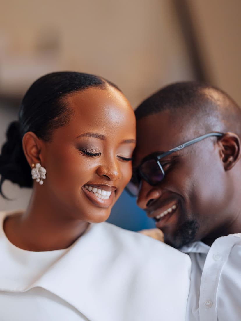 Smiling couple in close portrait embrace