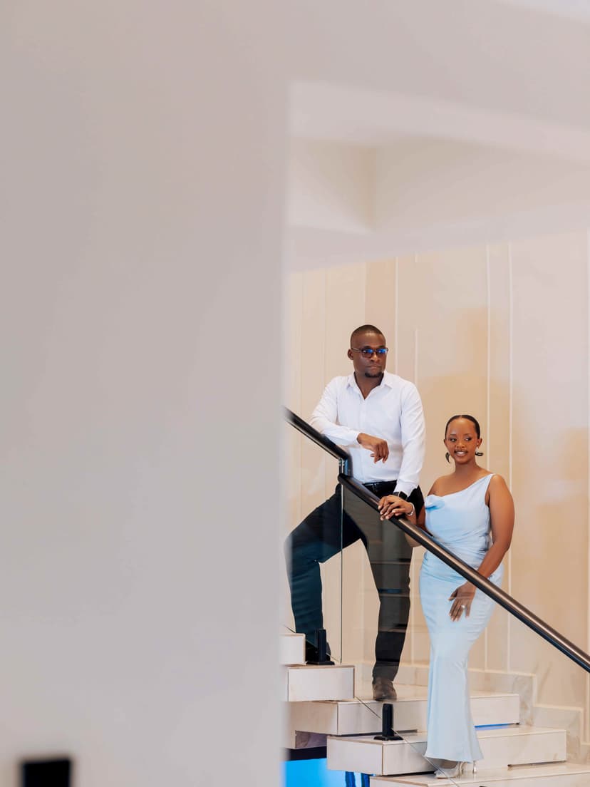 Couple on modern stairs in elegant attire